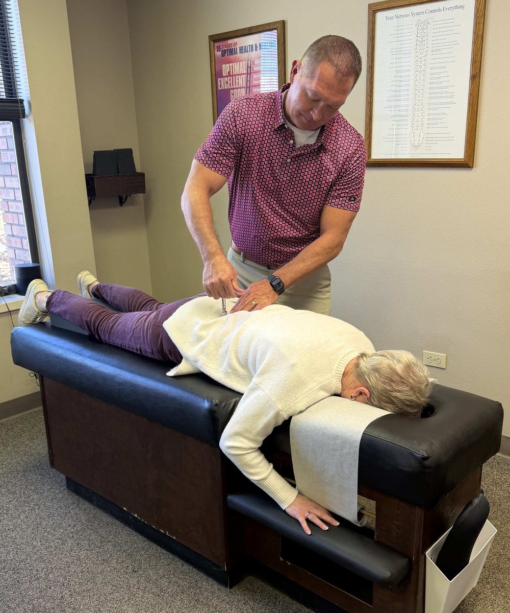 Dr. Aaron Smith performing a chiropractic spinal adjustment on a patient at Back to Health Chiropractic in Colorado Springs
