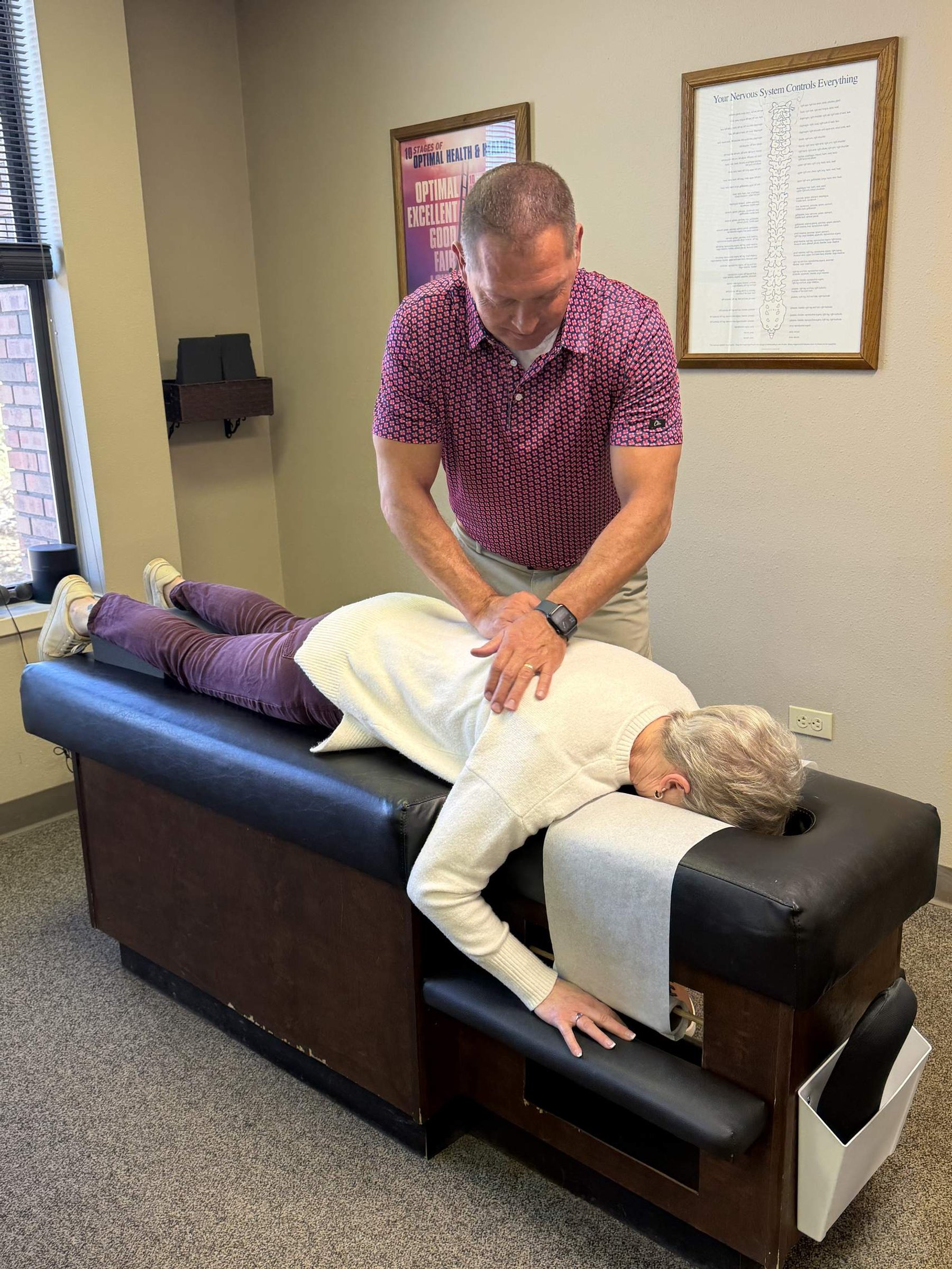 Dr. Aaron Smith performing a chiropractic adjustment at Back to Health Chiropractic in Colorado Springs